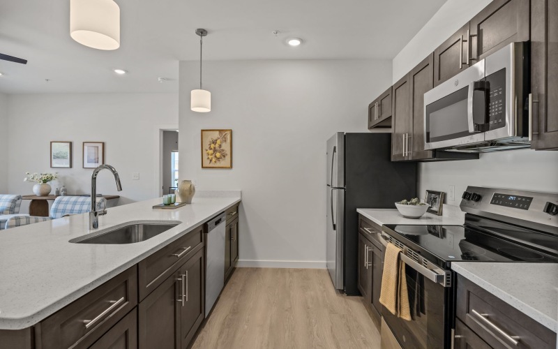 a kitchen with a white island counter top