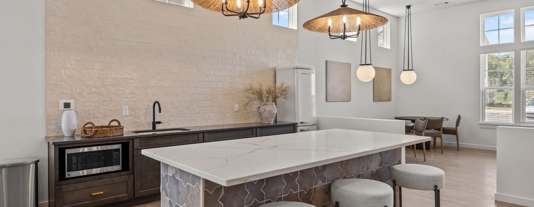 a community kitchen with a white island counter top