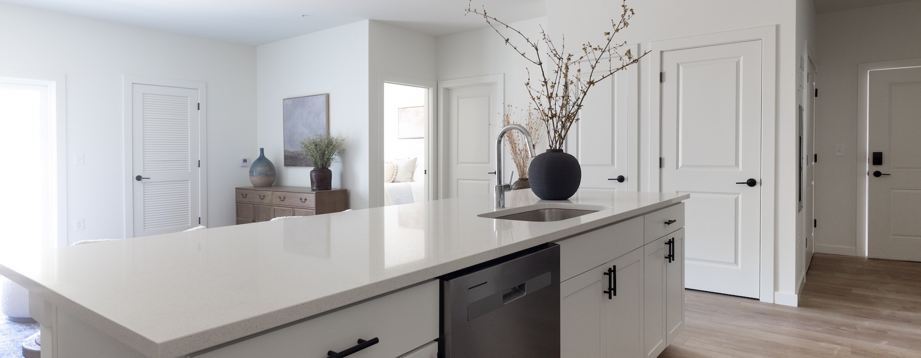 a kitchen with a white island counter top