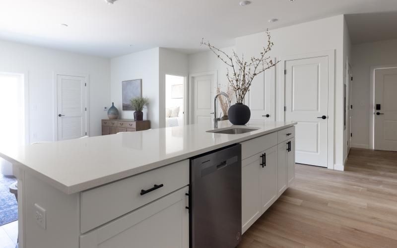 a kitchen with a white island counter top